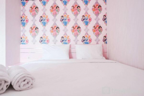 Homey and Fresh 2BR Green Pramuka Apartment By Travelio